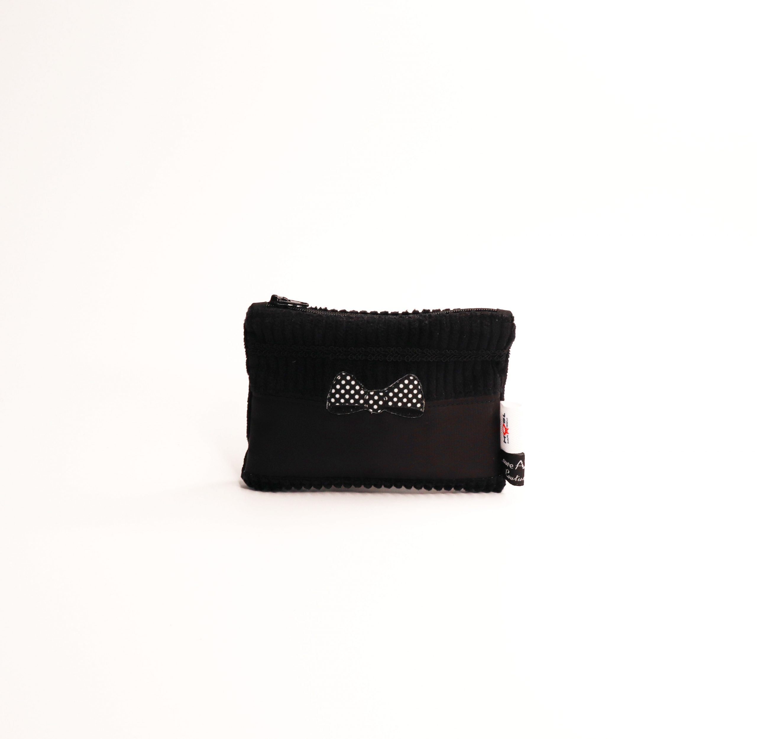 Porte-monnaie noir en velours côtelé doté d’un nœud noir et de pois blancs
