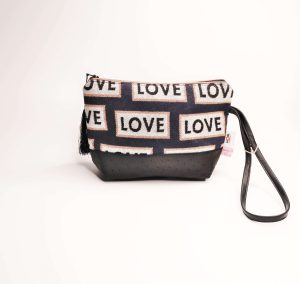 Sequin pouch with love pattern