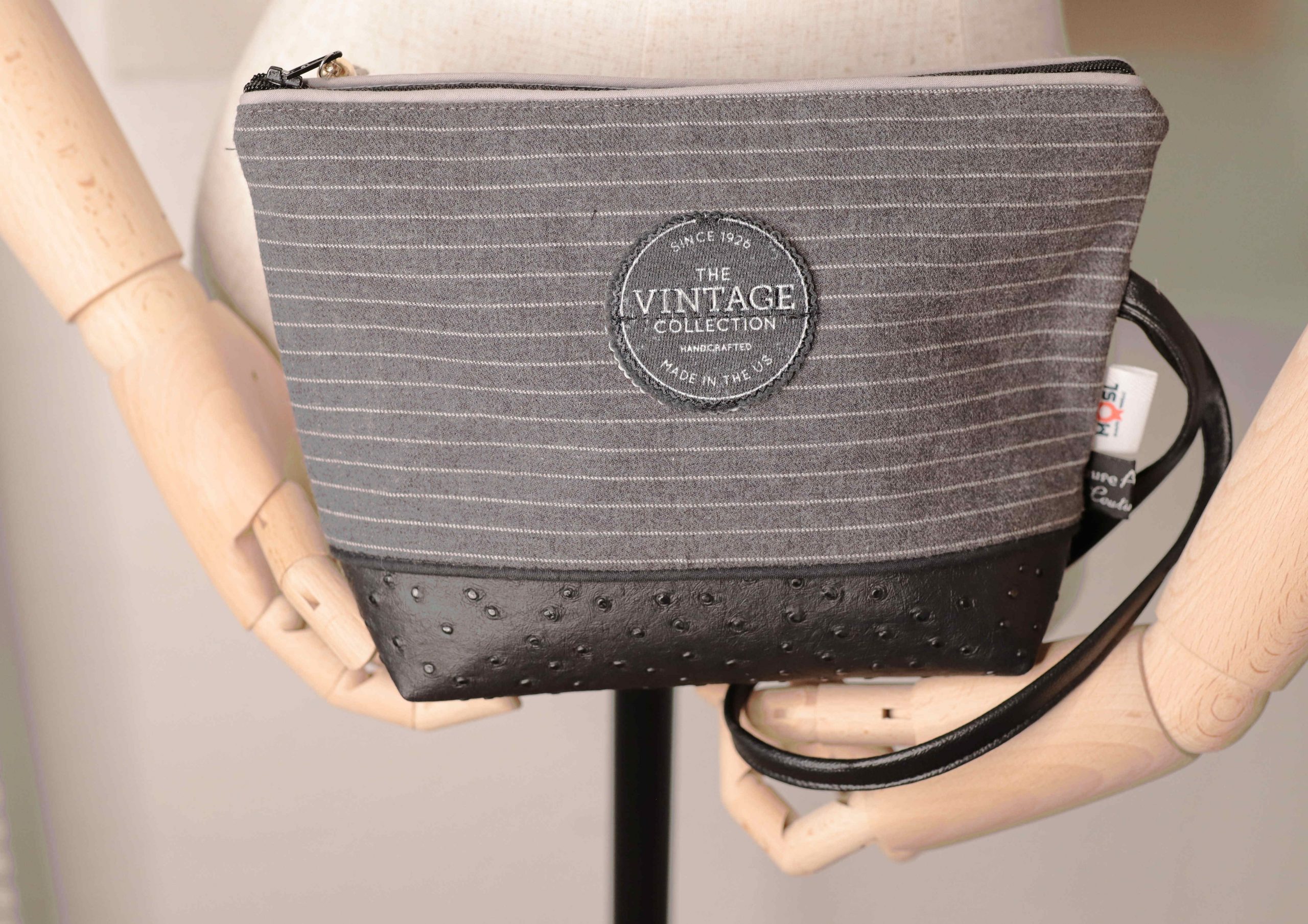 Black pouch with grey and white stripes